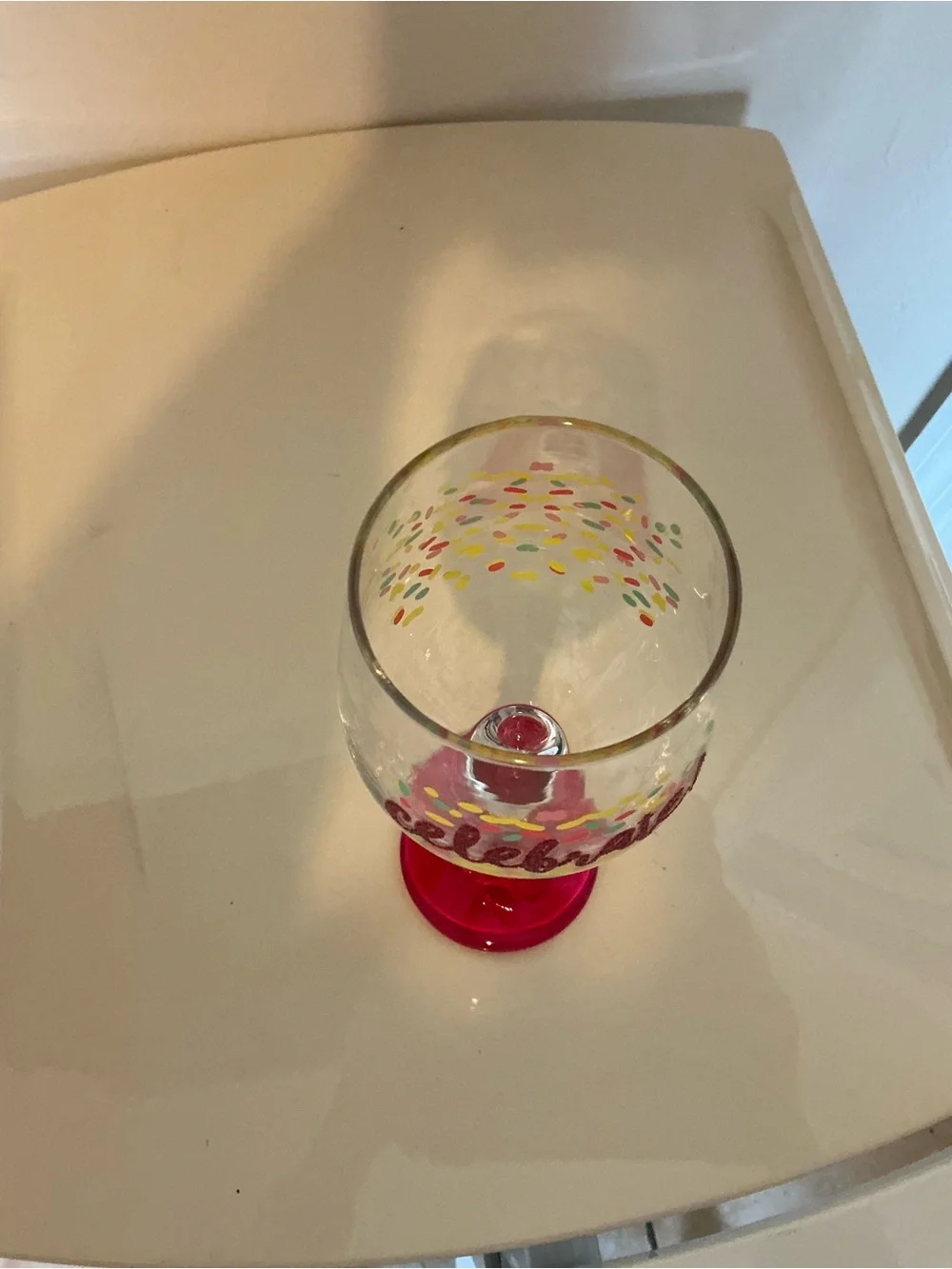 Hand Painted Celebrate Pink Stemmed Wine Glass with colorful Confetti Design